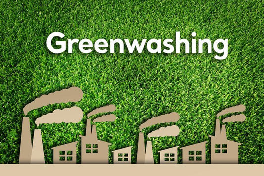 Greenwashing concept with factories and smoke on green grass background, symbolizing deceptive eco-friendly claims.